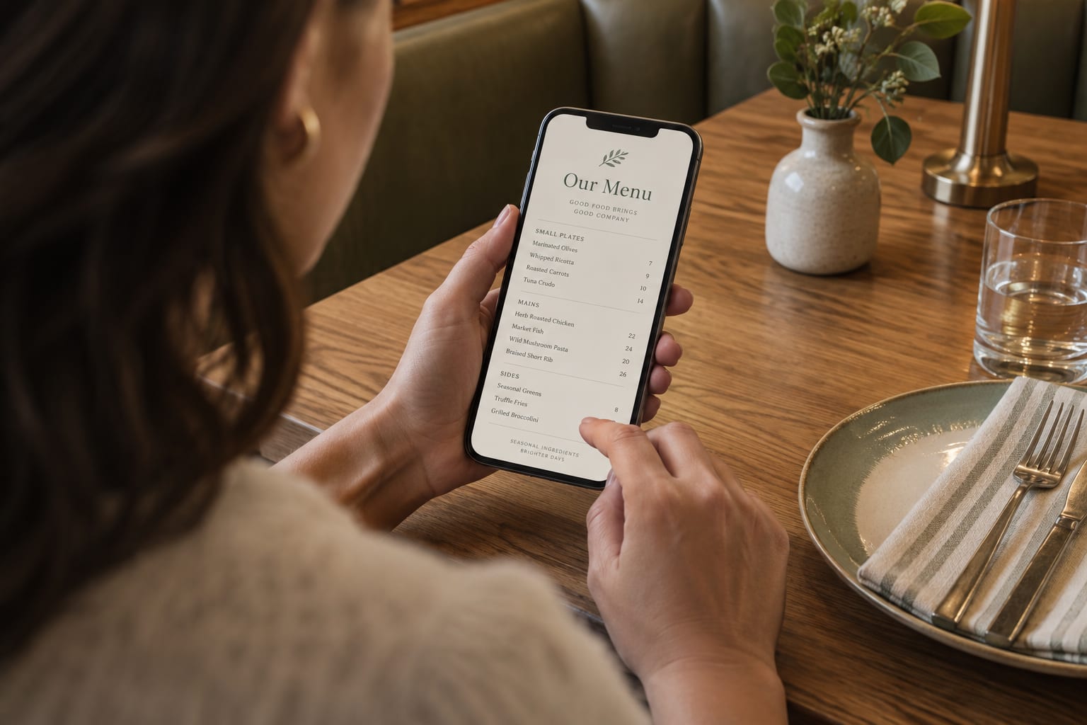 A diner browsing a digital restaurant menu on a phone